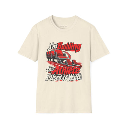 Graphic fitness T-shirt featuring the "I'm Building the Athlete I Used to Watch" design.