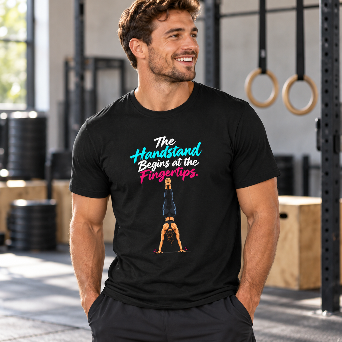 Male lifestyle mockup — The Handstand Begins at the Fingertips T-Shirt