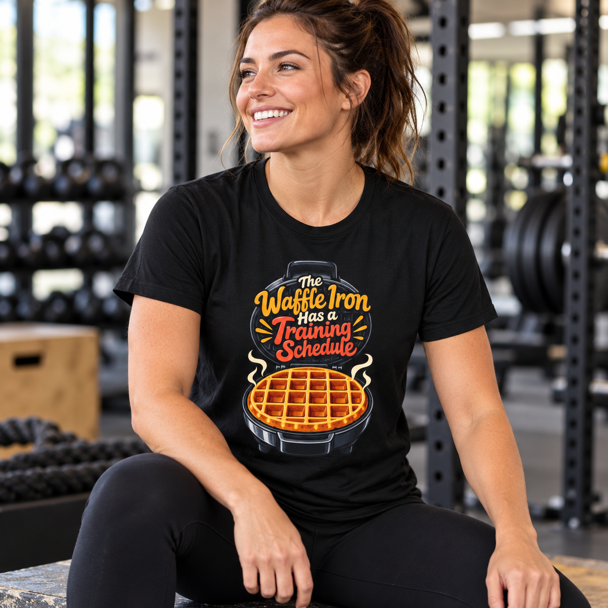 Female lifestyle mockup — The Waffle Iron Has a Training Schedule T-Shirt